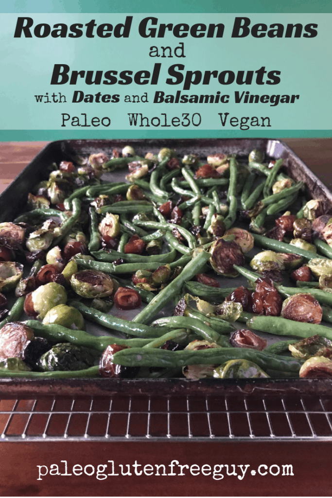Roasted green beans and Brussel sprouts on a baking sheet