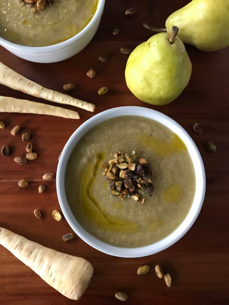 Parsnip, Pear and Pistachio Soup in a white bowl