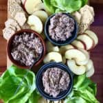 Tuna Sardine Salad on a wooden board with lettuce wraps, apple slices and crackers