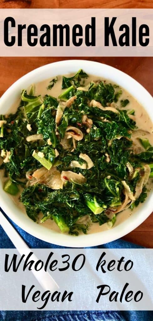 dairy-free creamed kale in a white bowl next to a denim napkin and spoon on a wooden table