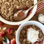 A strawberry rhubarb crisp recipe served in a baking dish and in a bowl with vanilla ice cream