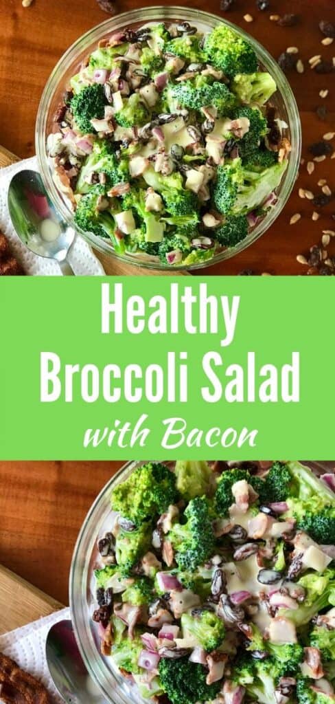 broccoli salad with bacon in a glass bowl surrounded by sunflower seeds, raisins, bacon and a spoon, all on a wooden table