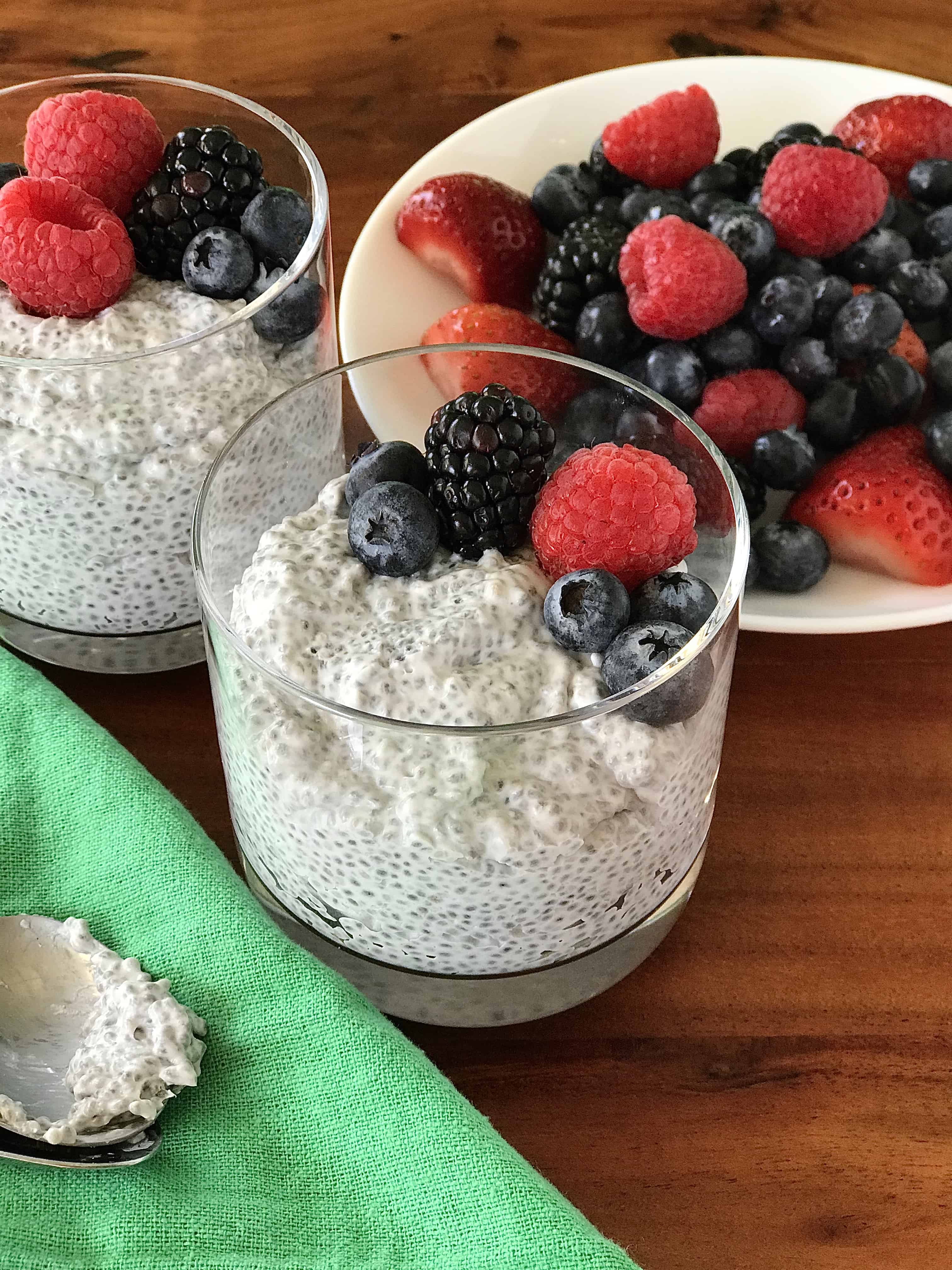 keto chia pudding in glasses topped with berries