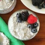 vanilla chia pudding in a glass topped with berries
