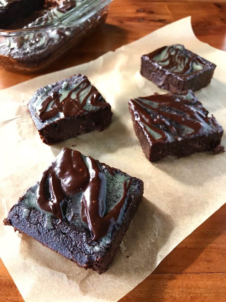 paleo brownies with almond flour cut into bars on parchment paper