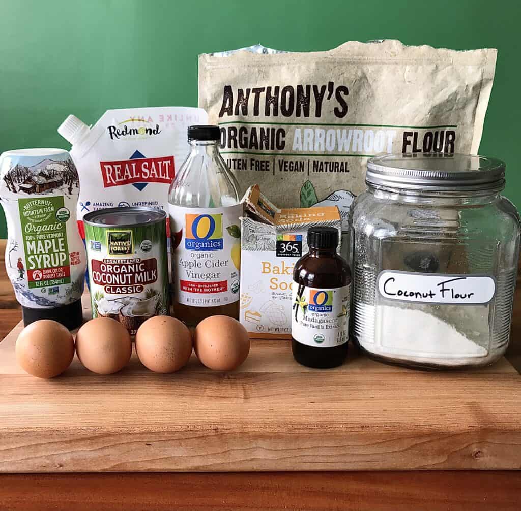 the ingredients to make grain-free pancakes on wooden cutting board