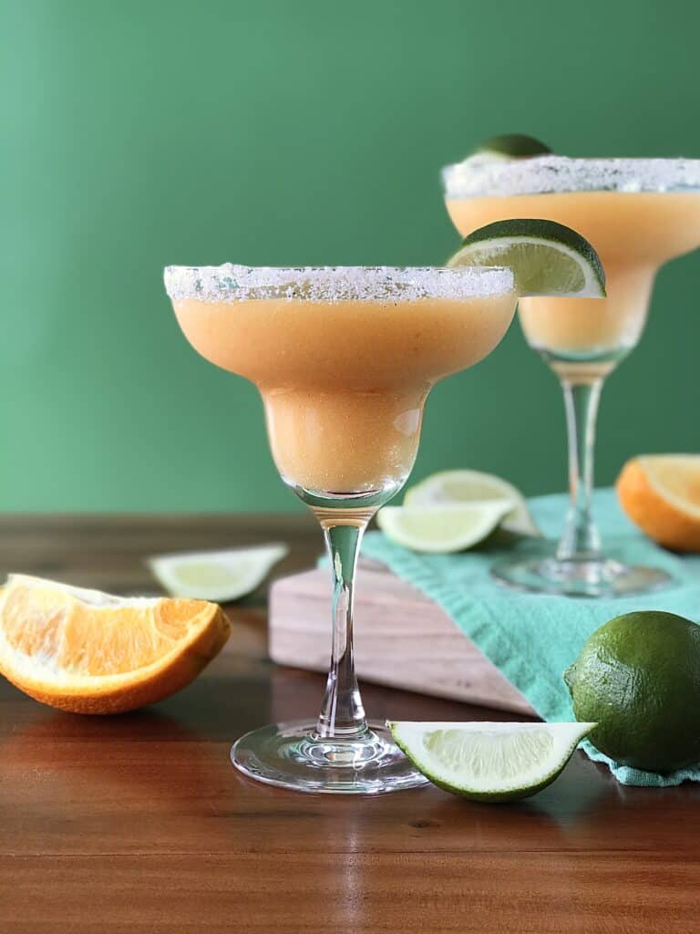 a healthy margarita made with frozen peaches, tequila, lime juice and orange juice