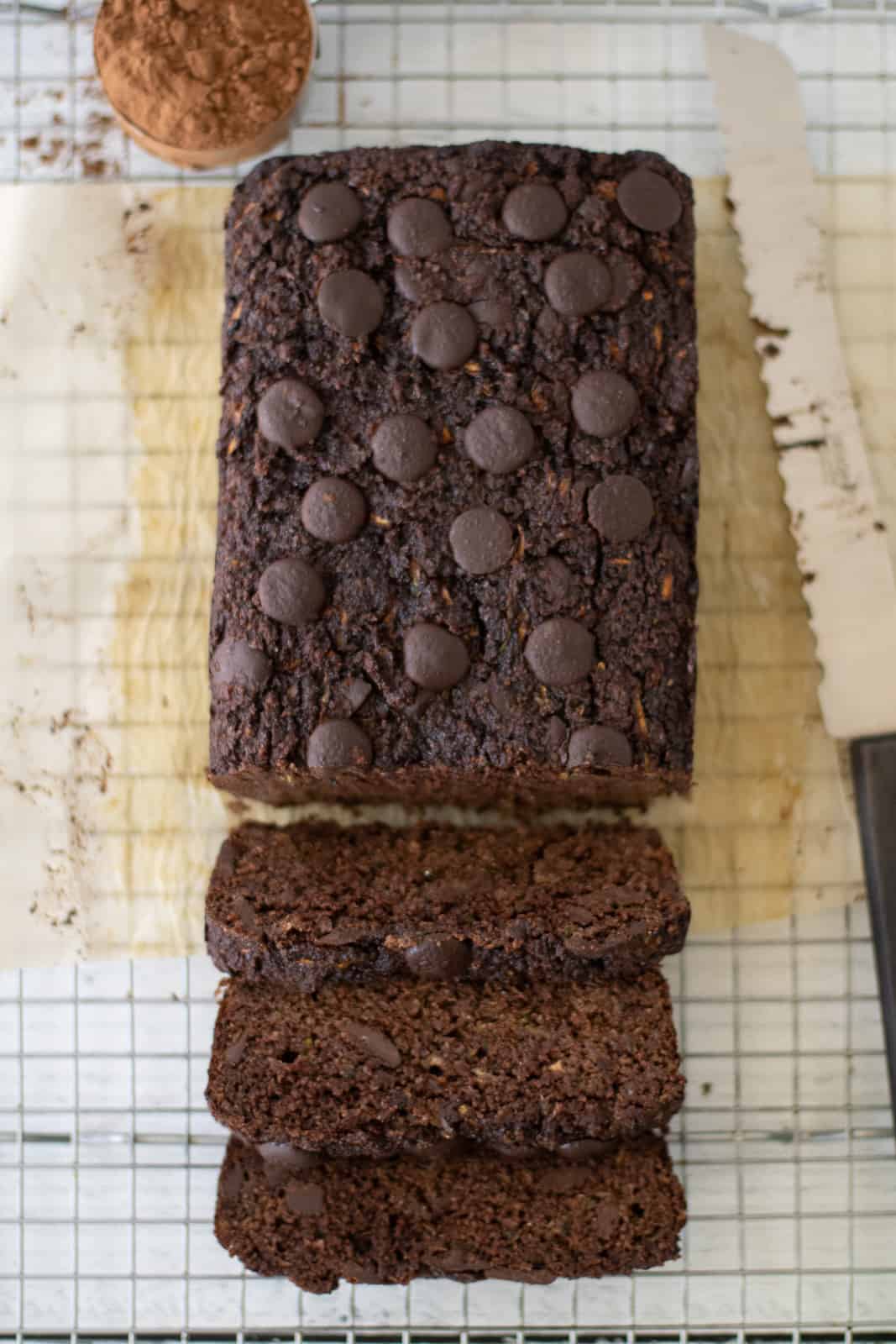 grain-free chocolate zucchini bread sliced on a cooling rack