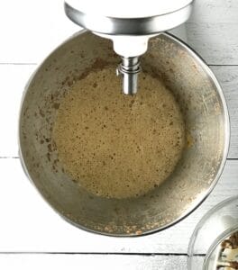 the wet ingredients of a cake batter blended in a stand mixer bowl