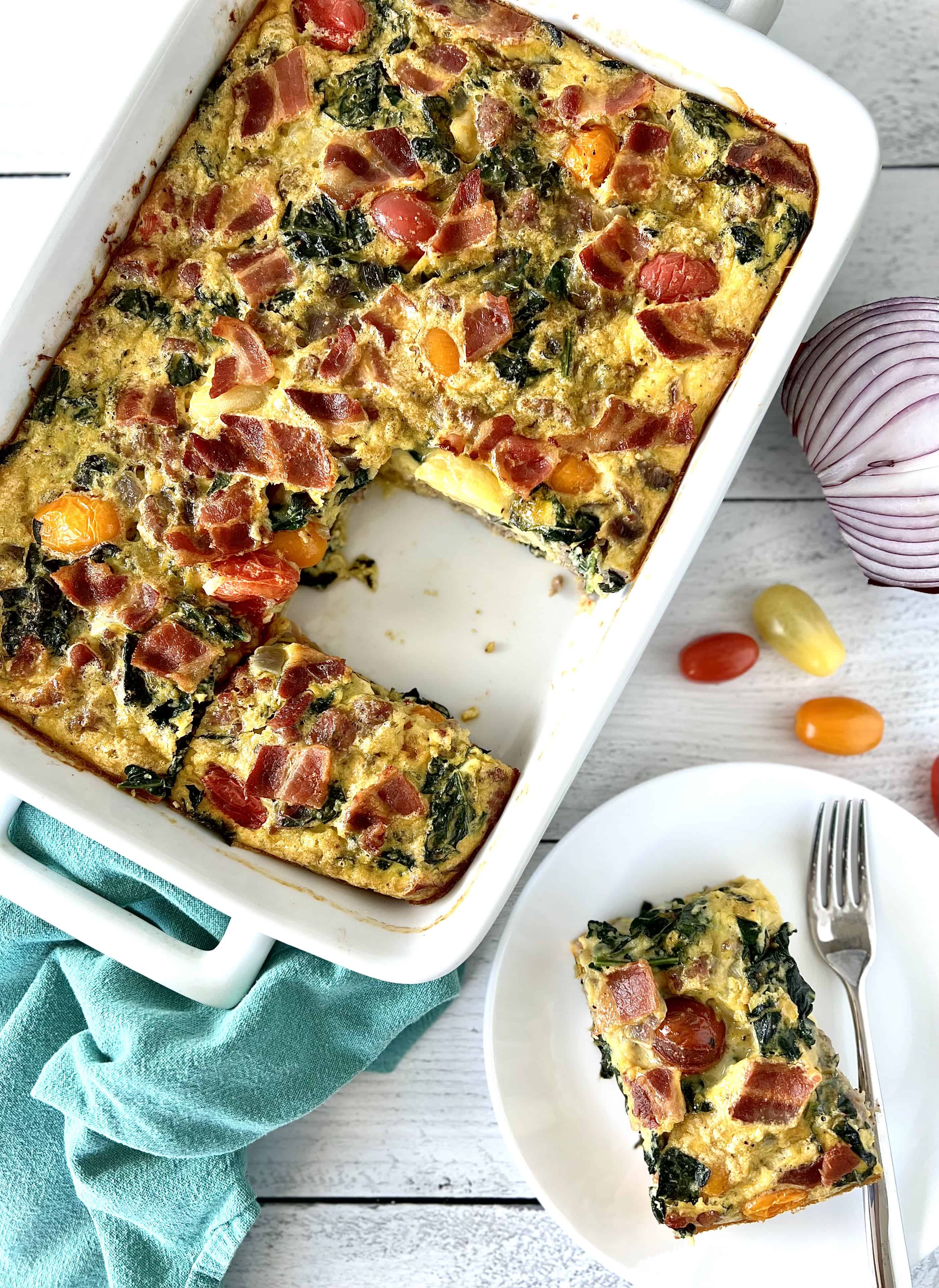 Whole30 Egg Bake in a white rectangular baking dish and a rectangular slice on a white plate with a fork