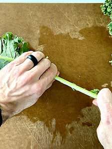 stripping kale leaves