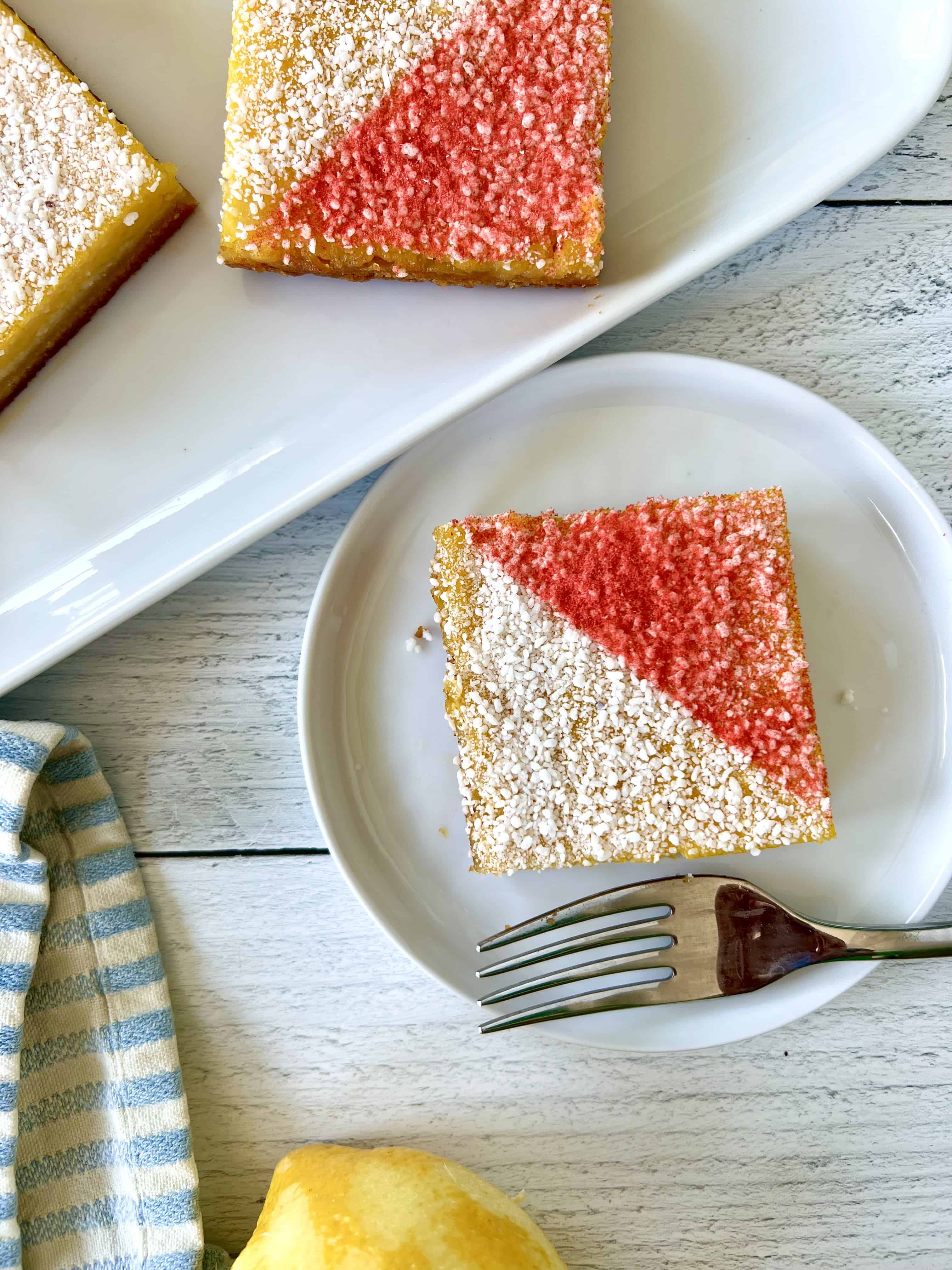 Grain-free lemon bars dusted with crushed freeze-dried strawberries.