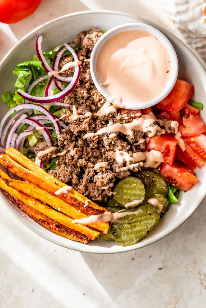 A burger bowl in a large white bowl.