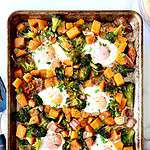 Bacon, squash, broccoli and eggs baked on a baking sheet.