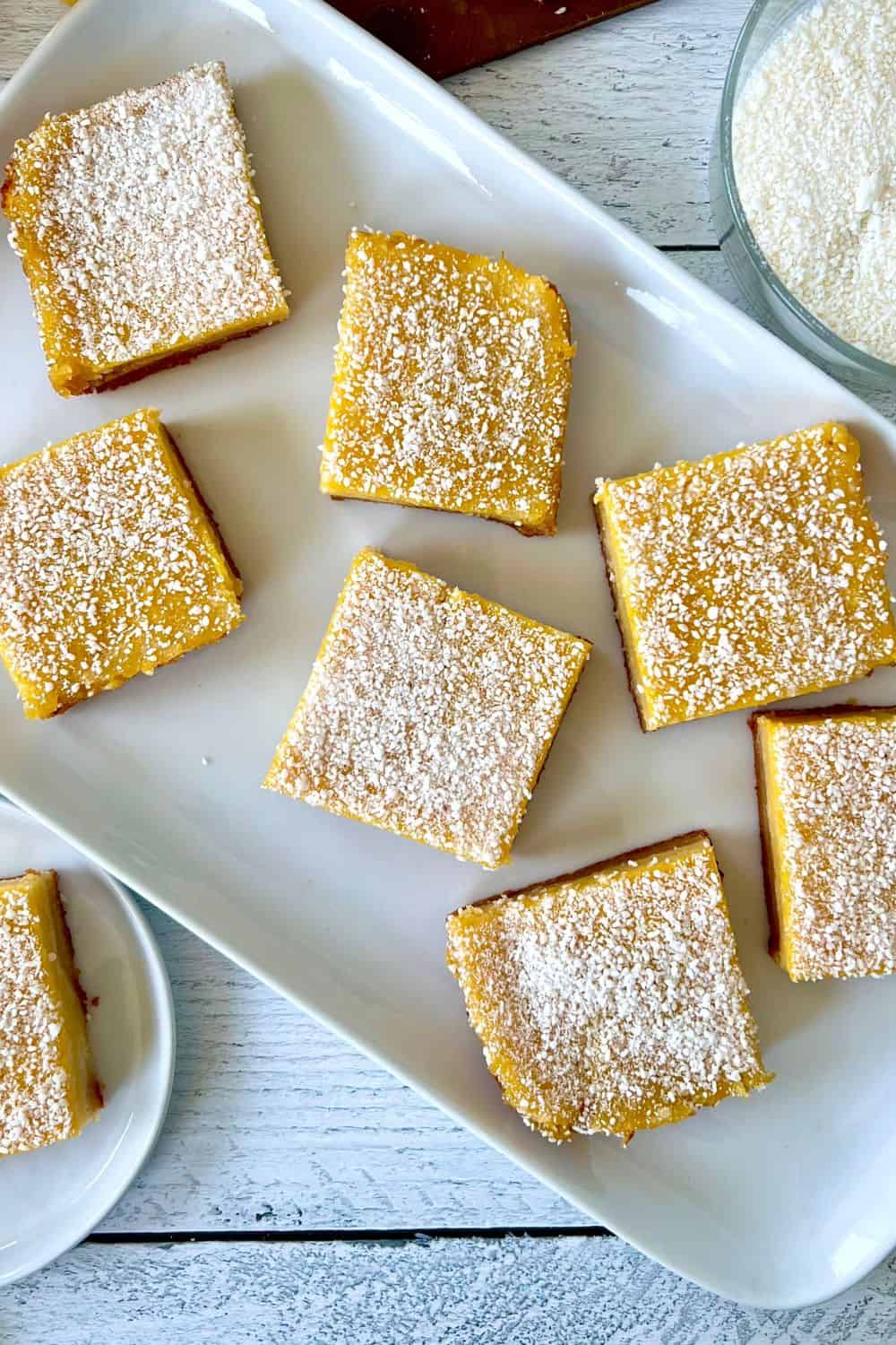 Healthy lemon bars on a long rectangular platter.
