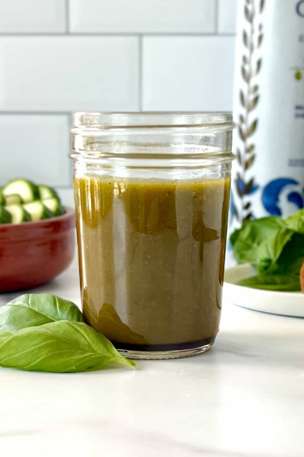 Basil Balsamic Dressing in a glass mason jar.