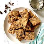 A pile of almond flour chocolate chip bars on a plate.