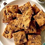 A pile of paleo cookie bars on a plate.