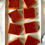 Paleo pumpkin pie bars on a rectangular platter.